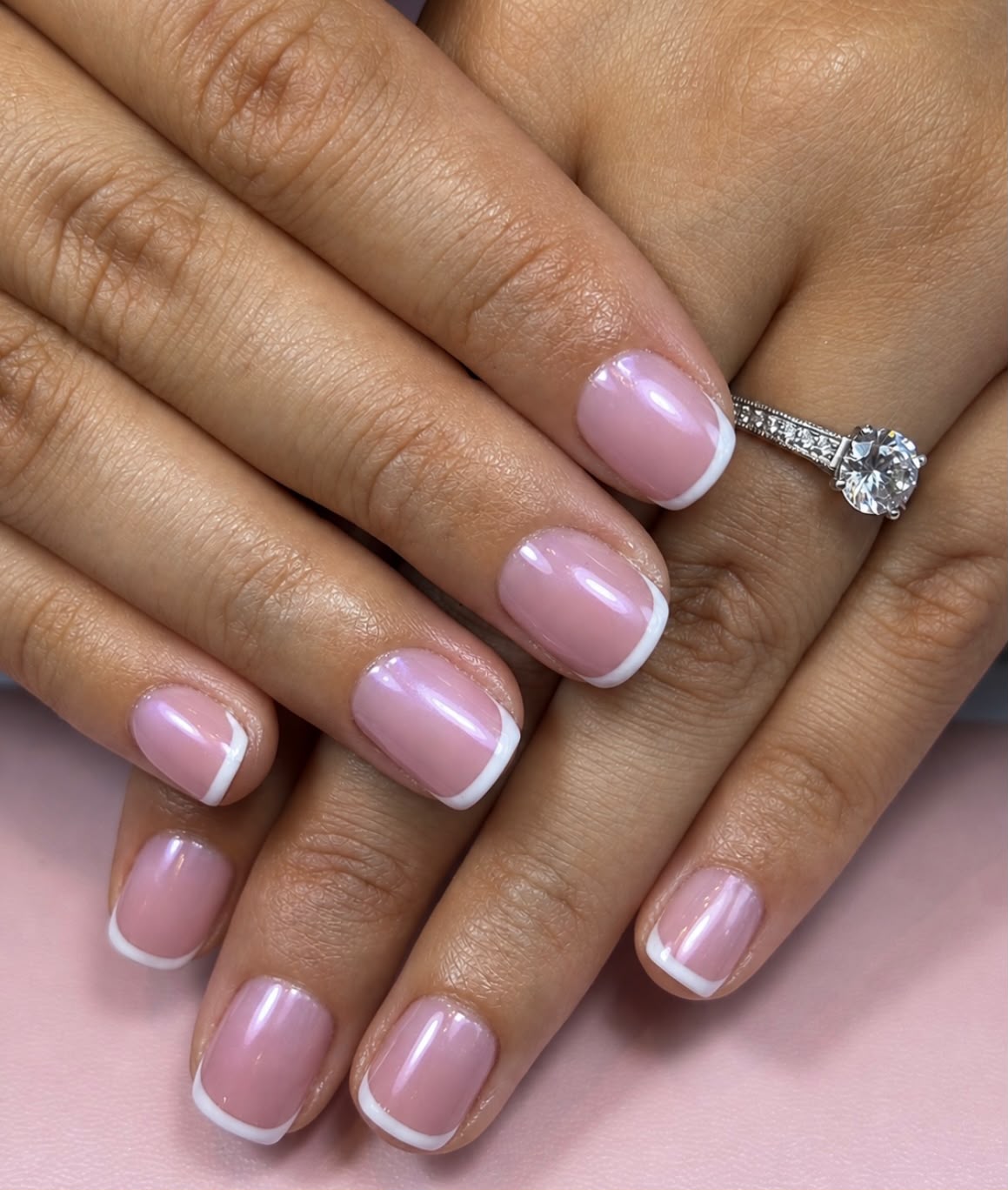 A welcoming and relaxing nail studio interior with a manicure table and soft lighting